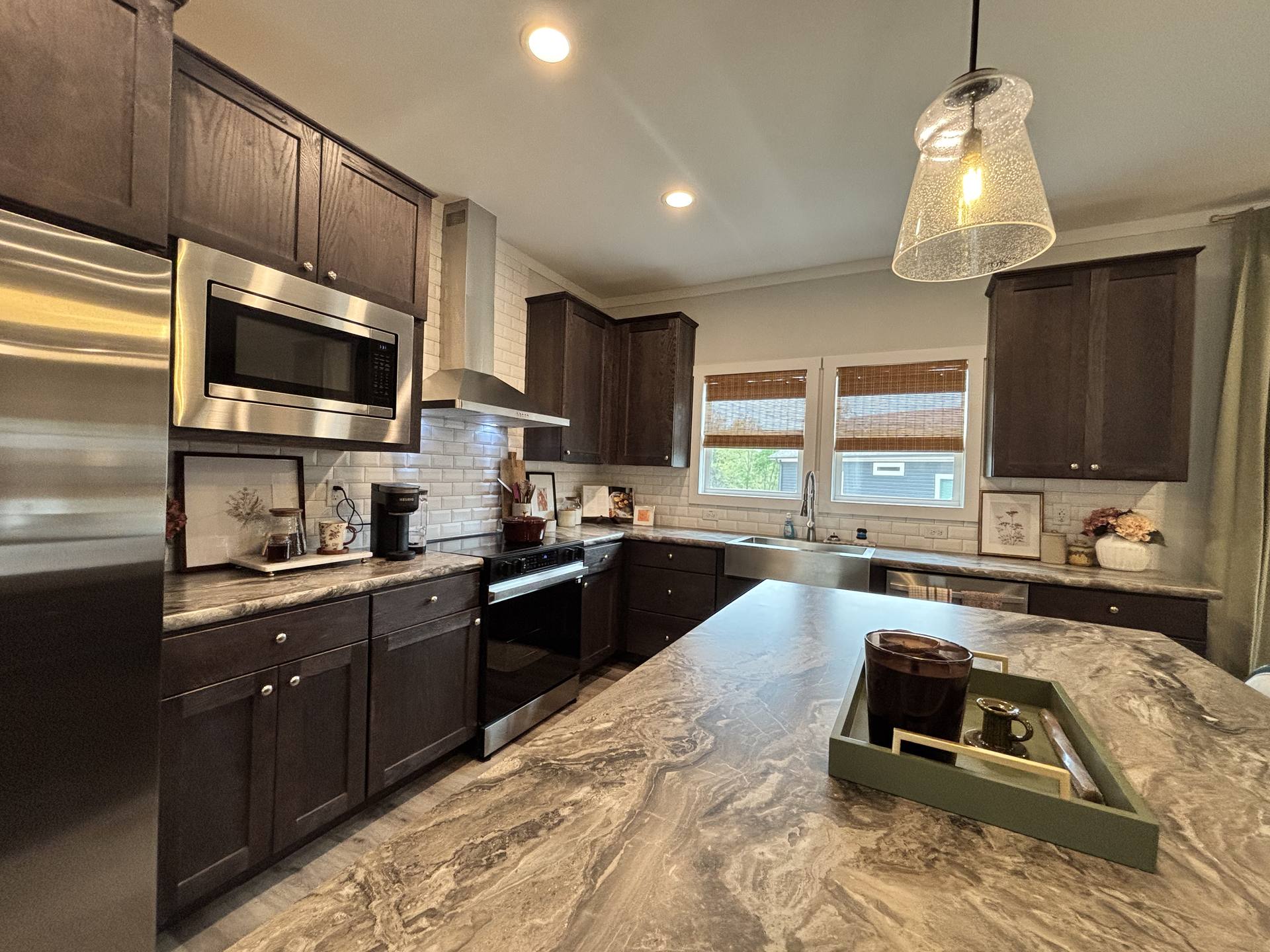 Spacious family kitchen with generous island at Harvest Meadow